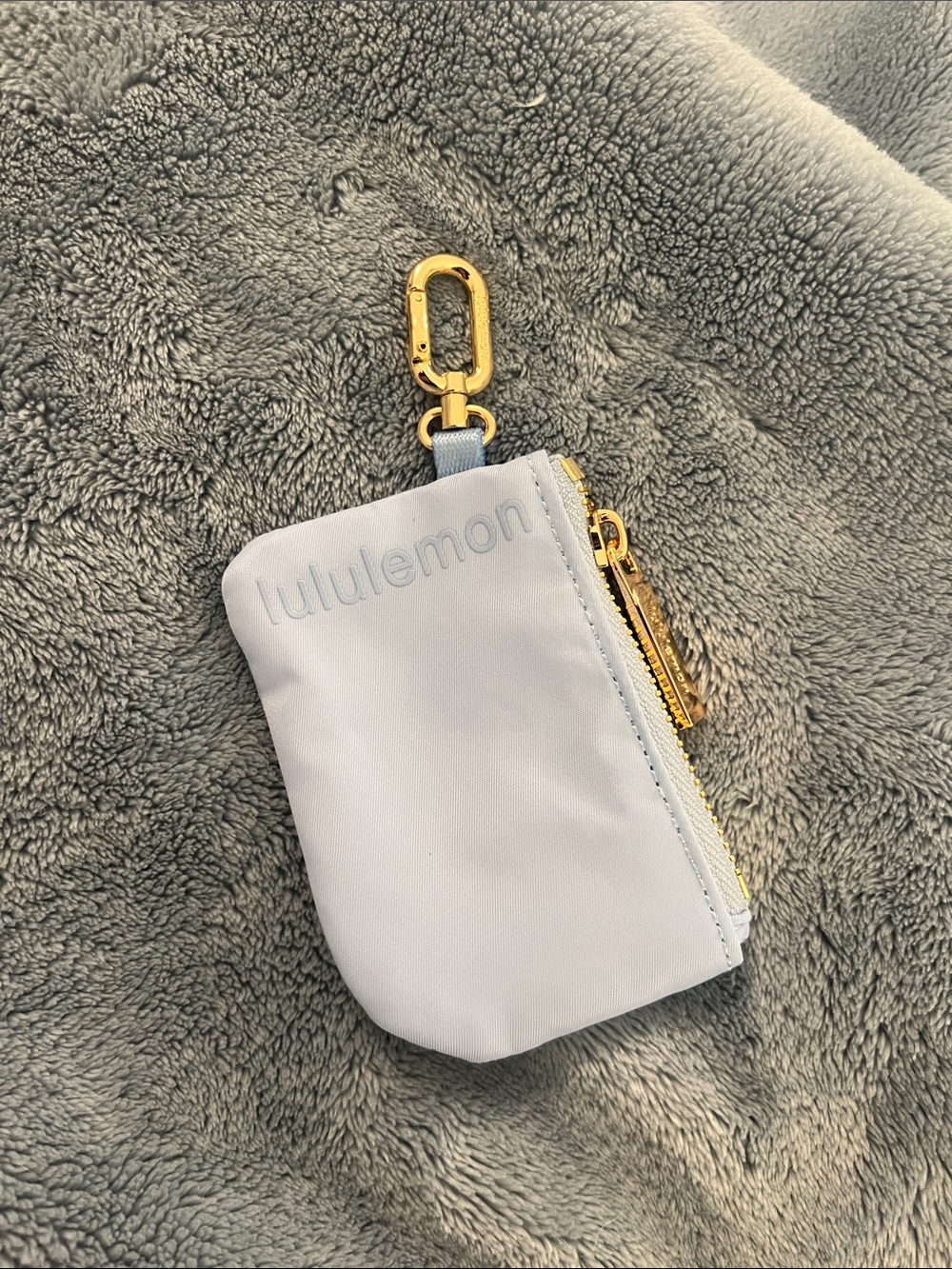 lululemon pale blue key pouch with gold hardware